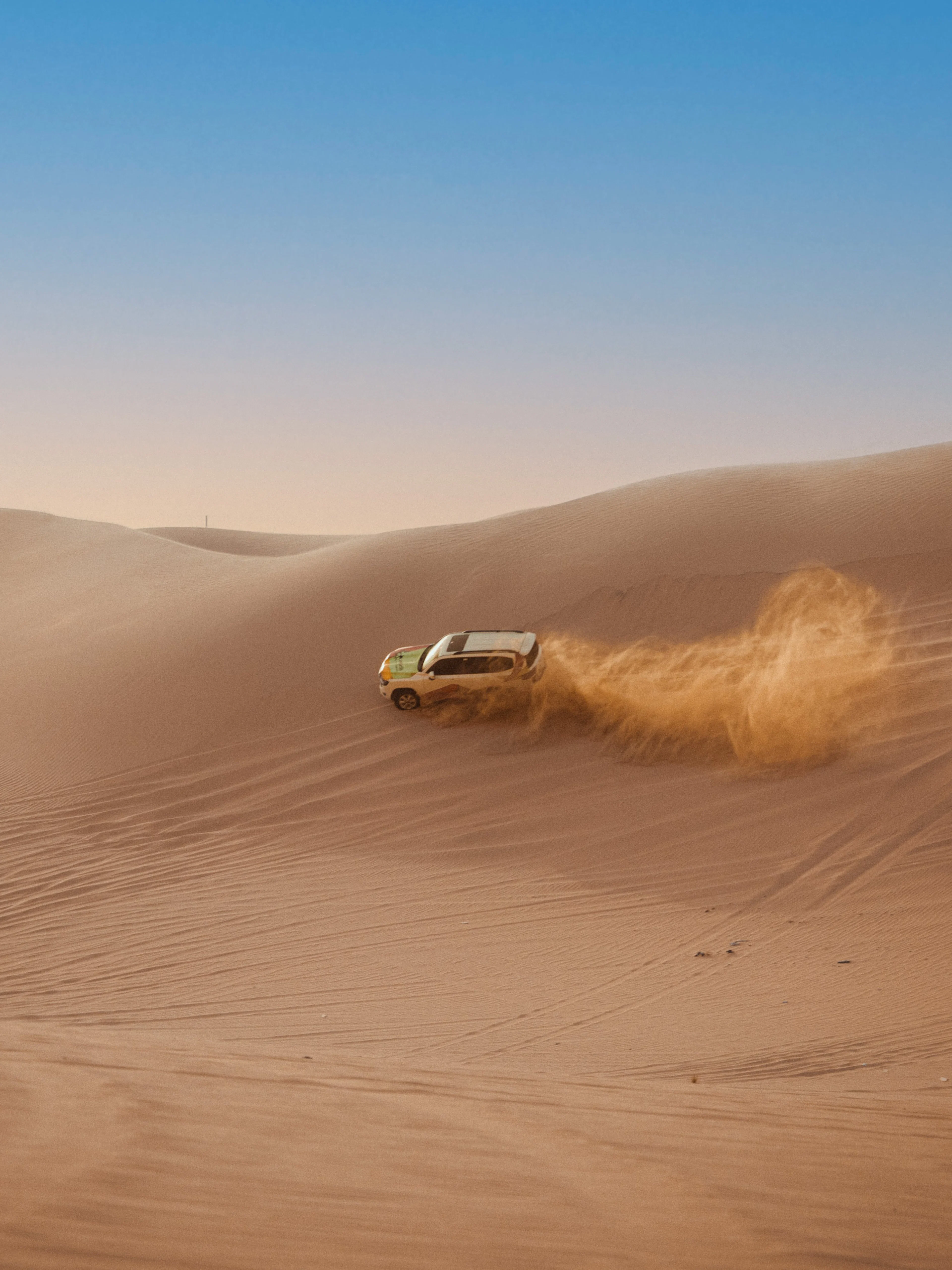 4X4 vehicle dune bashing in Abu Dhabi desert.