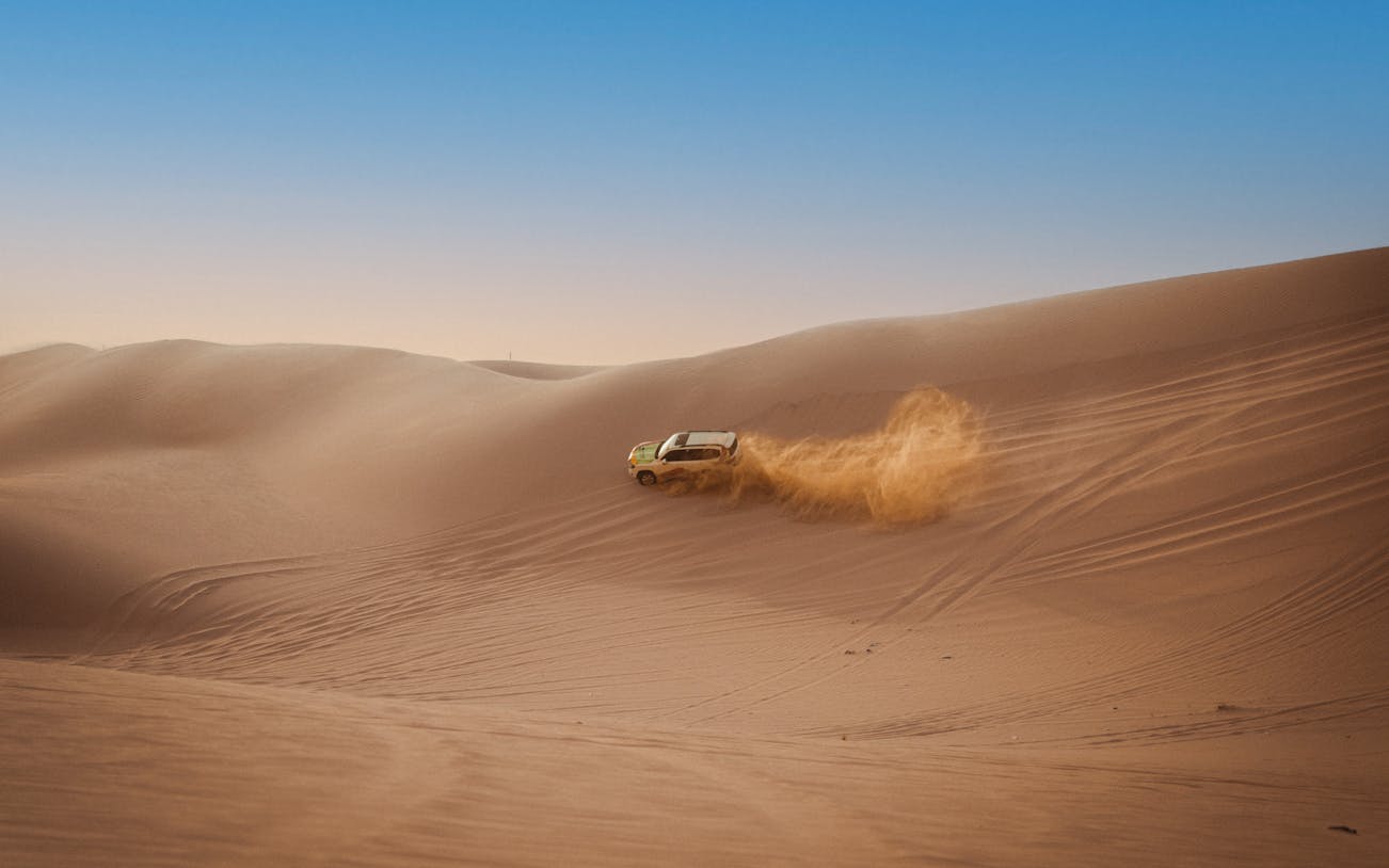 4X4 vehicle dune bashing in Abu Dhabi desert.