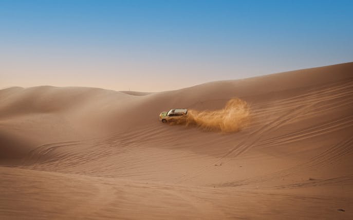 4X4 vehicle dune bashing in Abu Dhabi desert.