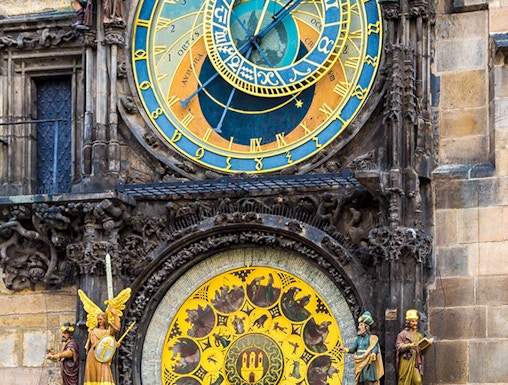 Astronomical Clock in Prague with zodiac signs and detailed sculptures.