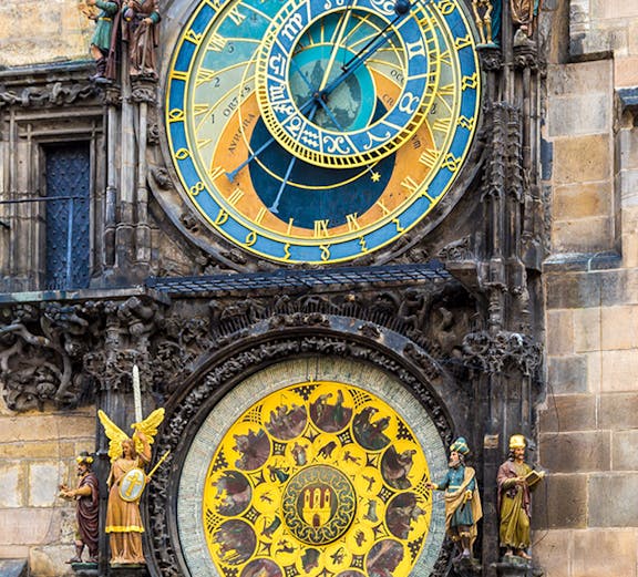 Astronomical Clock in Prague with zodiac signs and detailed sculptures.