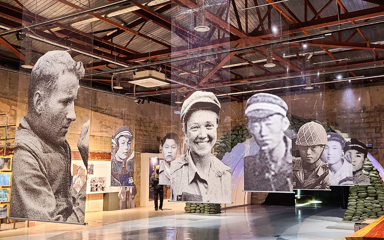 Hanging portraits of soldiers at DMZ museum exhibit in Paju, South Korea.