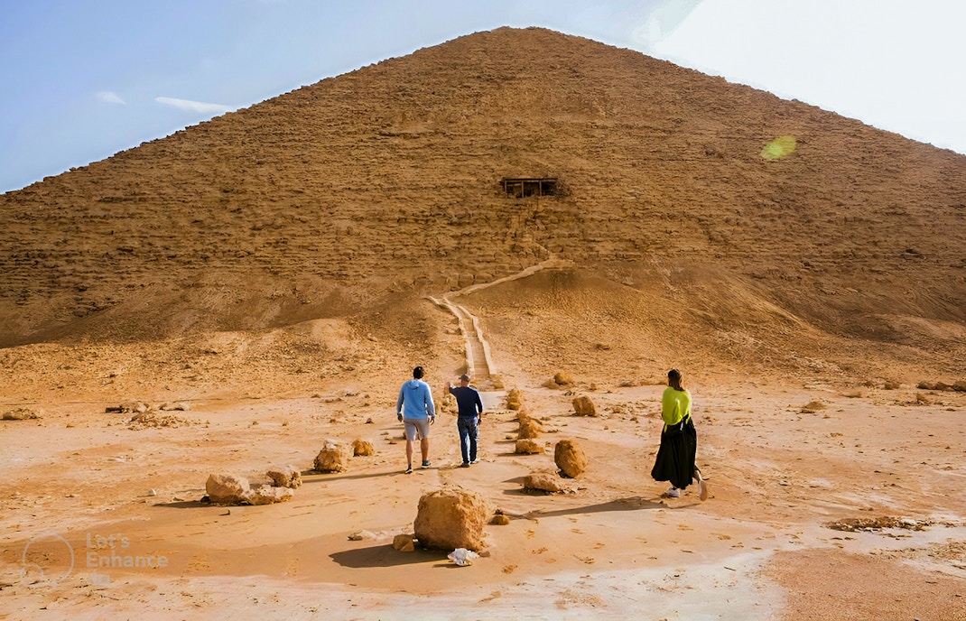Visitors walking towards the Pyramid of Djoser in Cairo, Egypt.