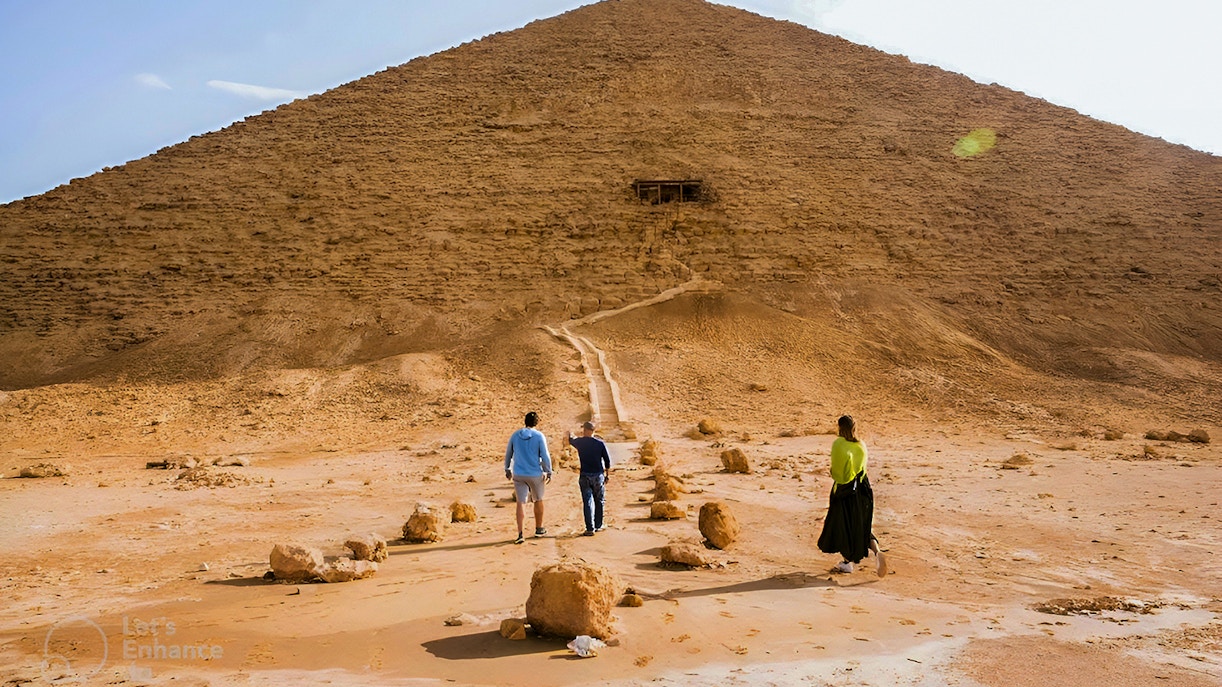 Visitors walking towards the Pyramid of Djoser in Cairo, Egypt.