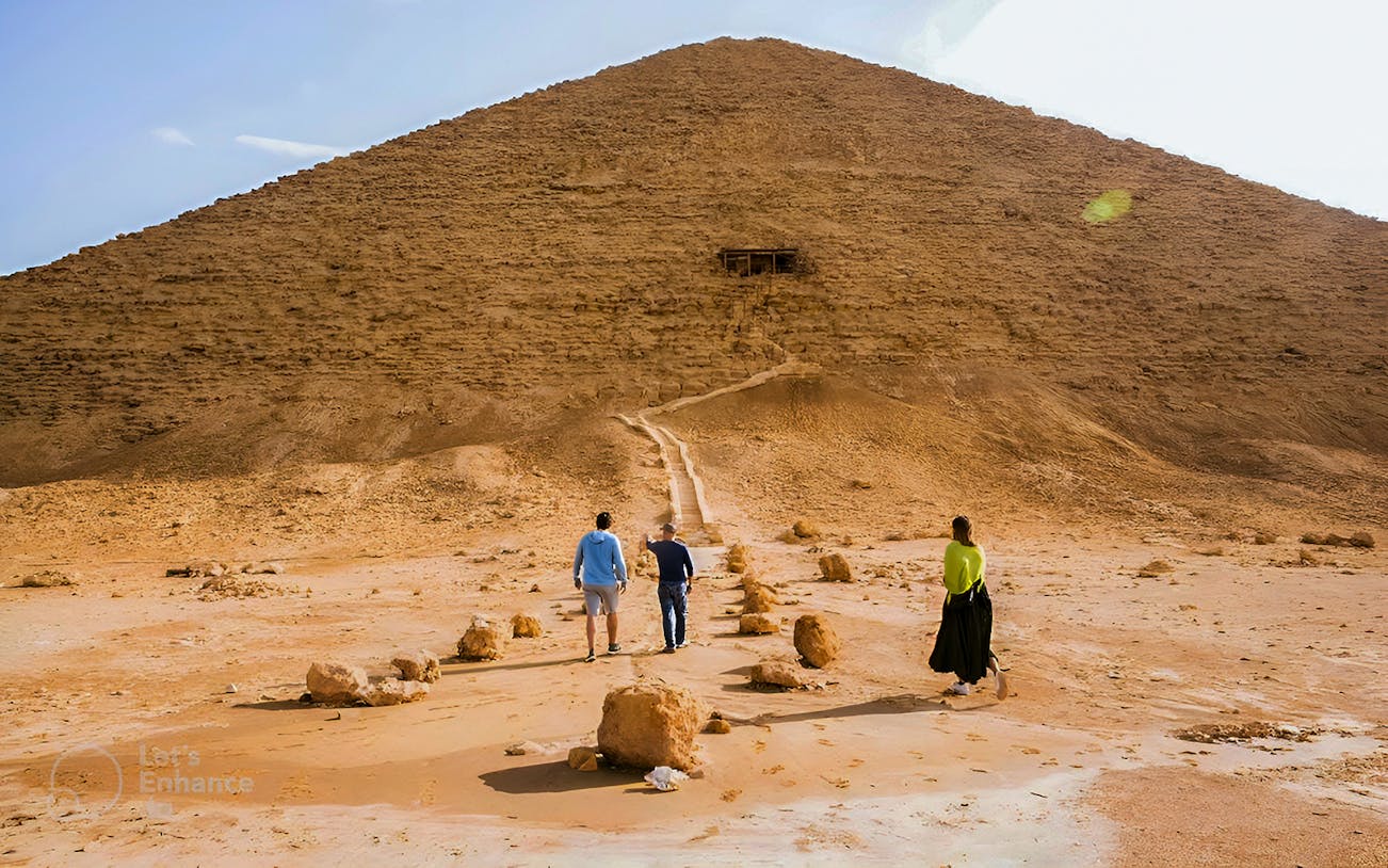 Visitors walking towards the Pyramid of Djoser in Cairo, Egypt.