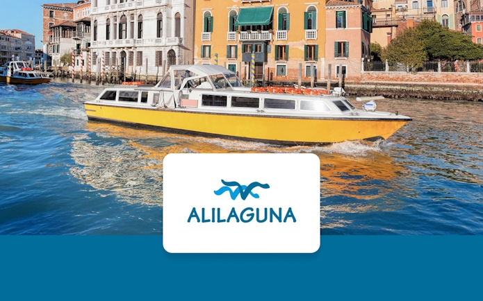 Alilaguna water bus on Venice's Grand Canal with historic buildings in the background.