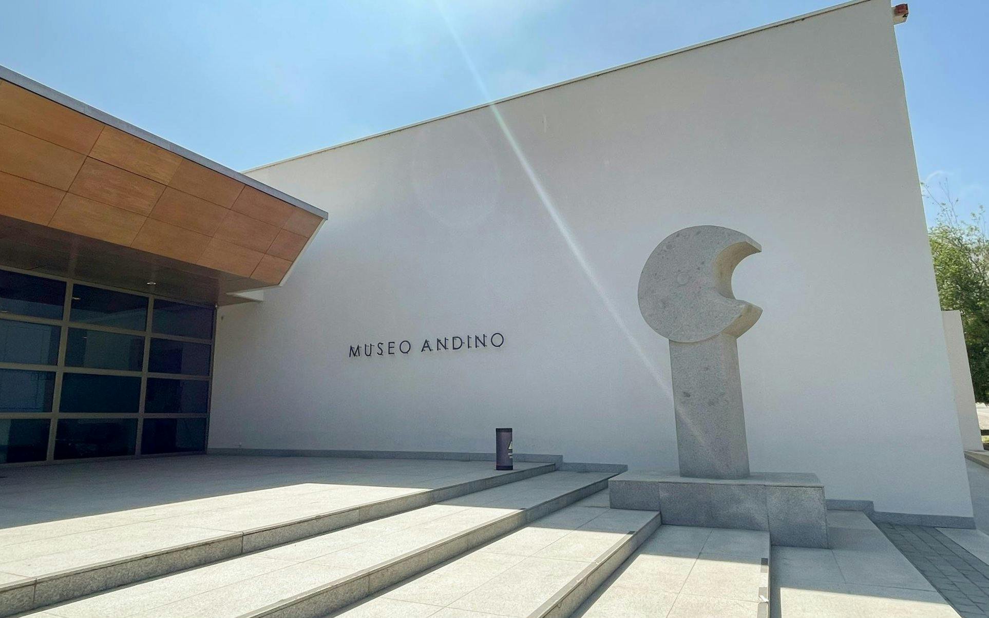 Modern exterior of Museo Andino with sculpture and entrance steps.