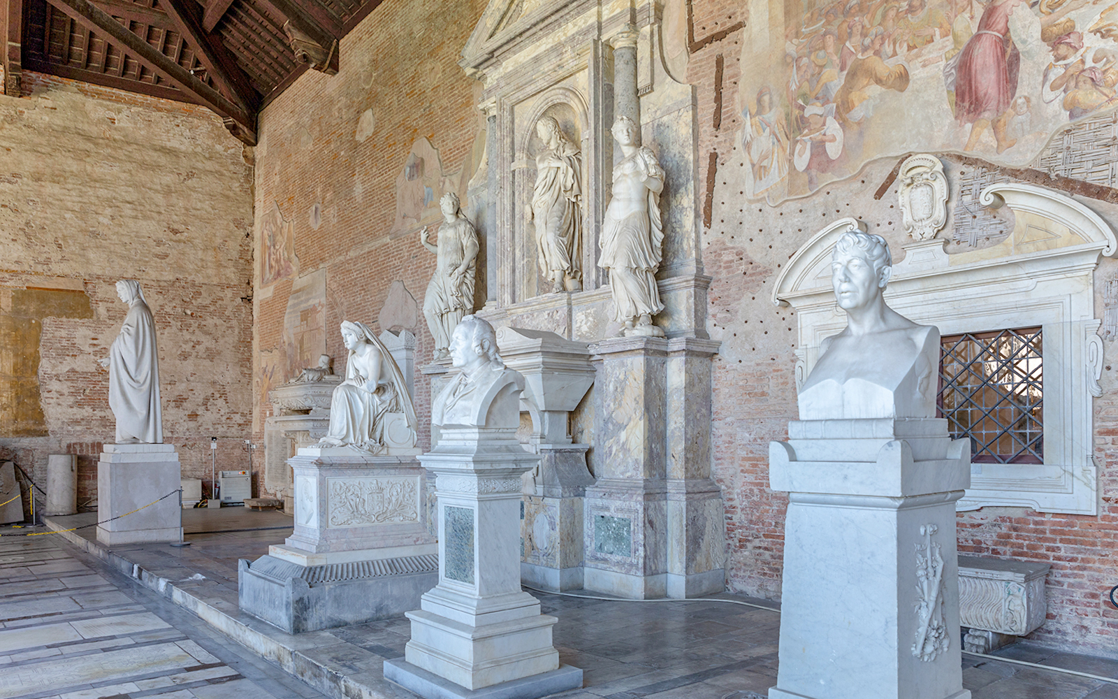 Sculptures inside Pisa Camposanto at Pisa Cathedral Square.