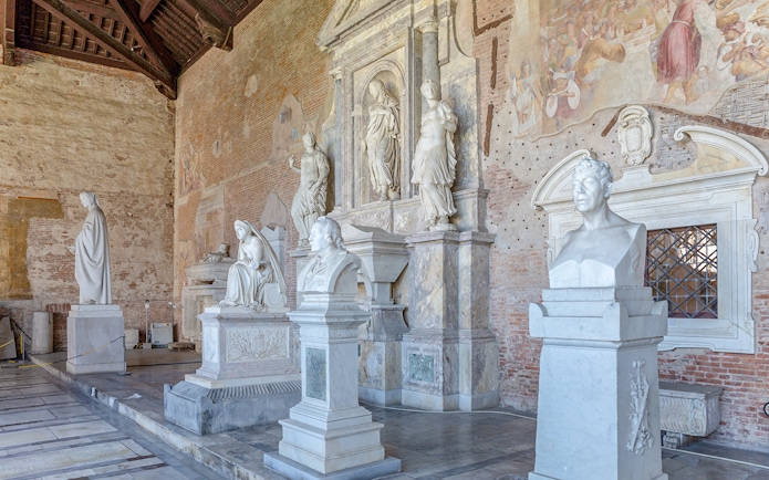 Sculptures inside Pisa Camposanto at Pisa Cathedral Square.