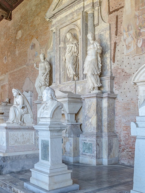 Sculptures inside Pisa Camposanto at Pisa Cathedral Square.