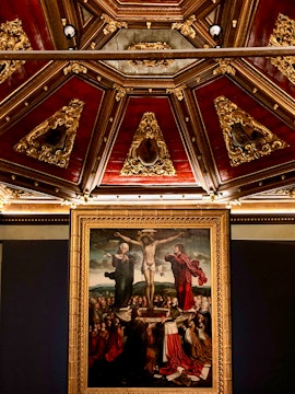 Crucifixion painting and ornate ceiling at Museu da Misericórdia do Porto.