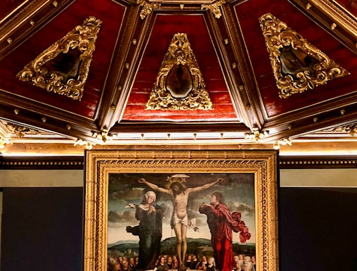 Crucifixion painting and ornate ceiling at Museu da Misericórdia do Porto.