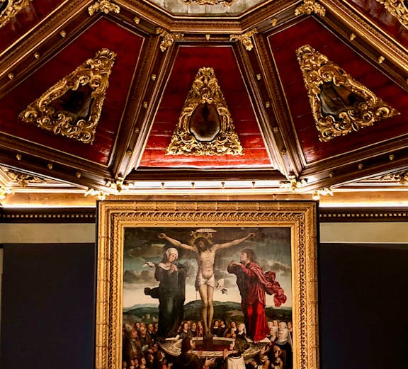 Crucifixion painting and ornate ceiling at Museu da Misericórdia do Porto.