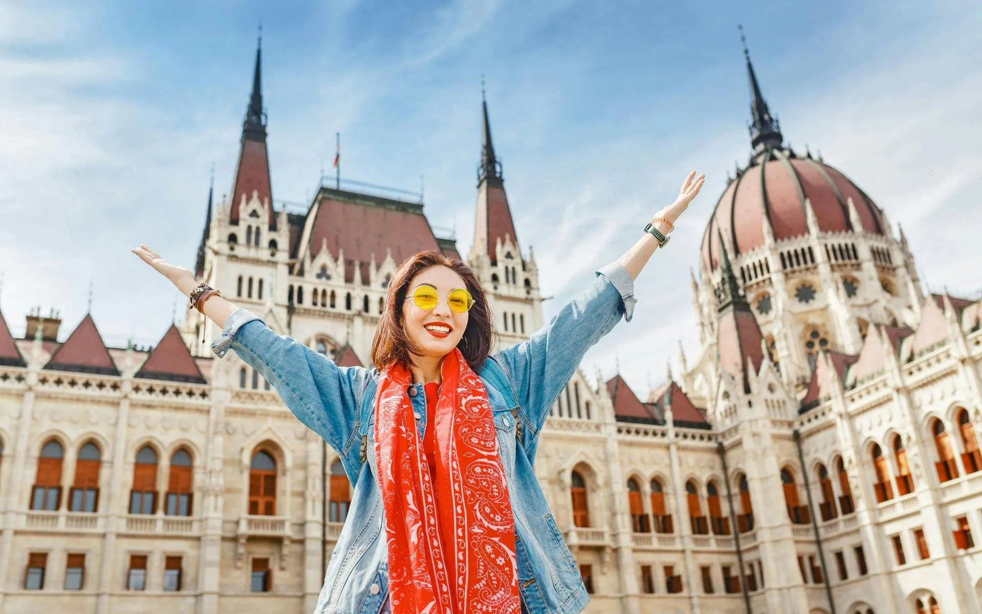 Visitor in front of Hungarian Parliament Building, Budapest, on St. Stephen Basilica Old Town Tour.