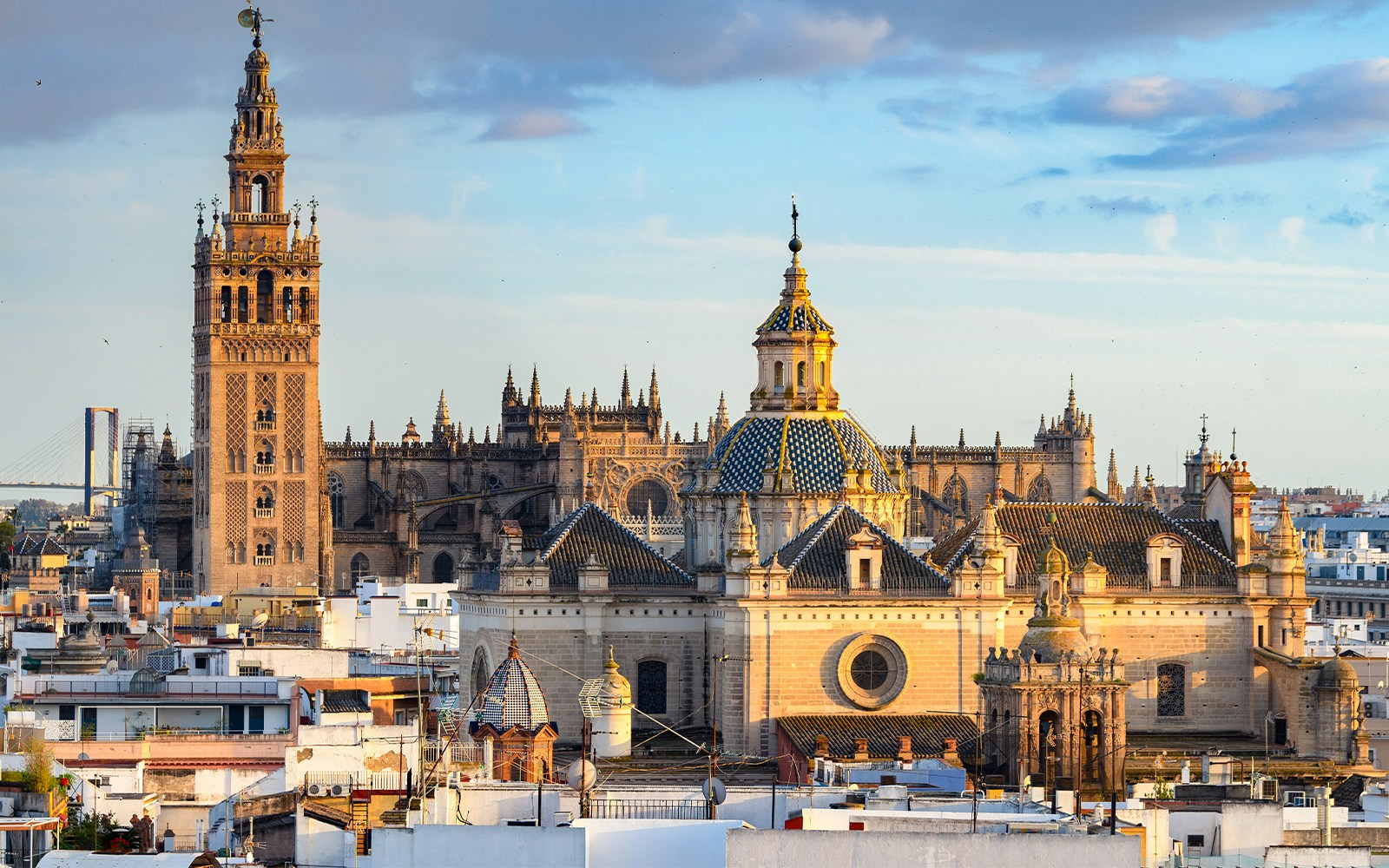 Seville Cathedral exterior with Gothic architecture and Giralda tower in Seville, Spain.