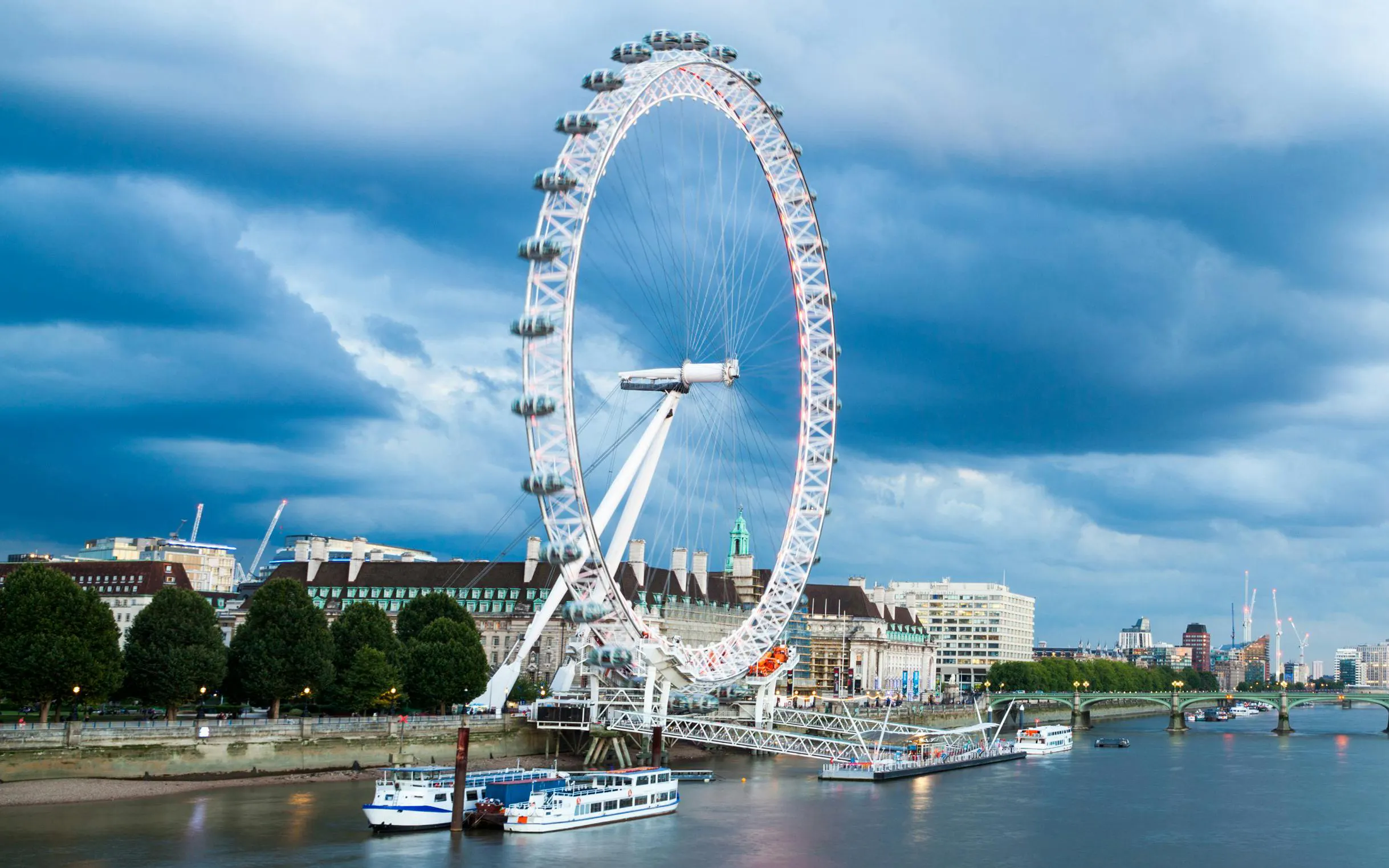 River Thames cruise with view of the London Eye and city skyline.