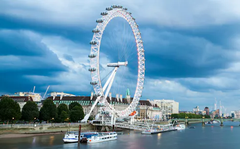 River Thames cruise with view of the London Eye and city skyline.