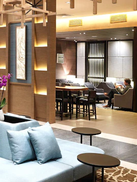 Plaza Premium Lounge seating area at London Heathrow Airport with modern decor.