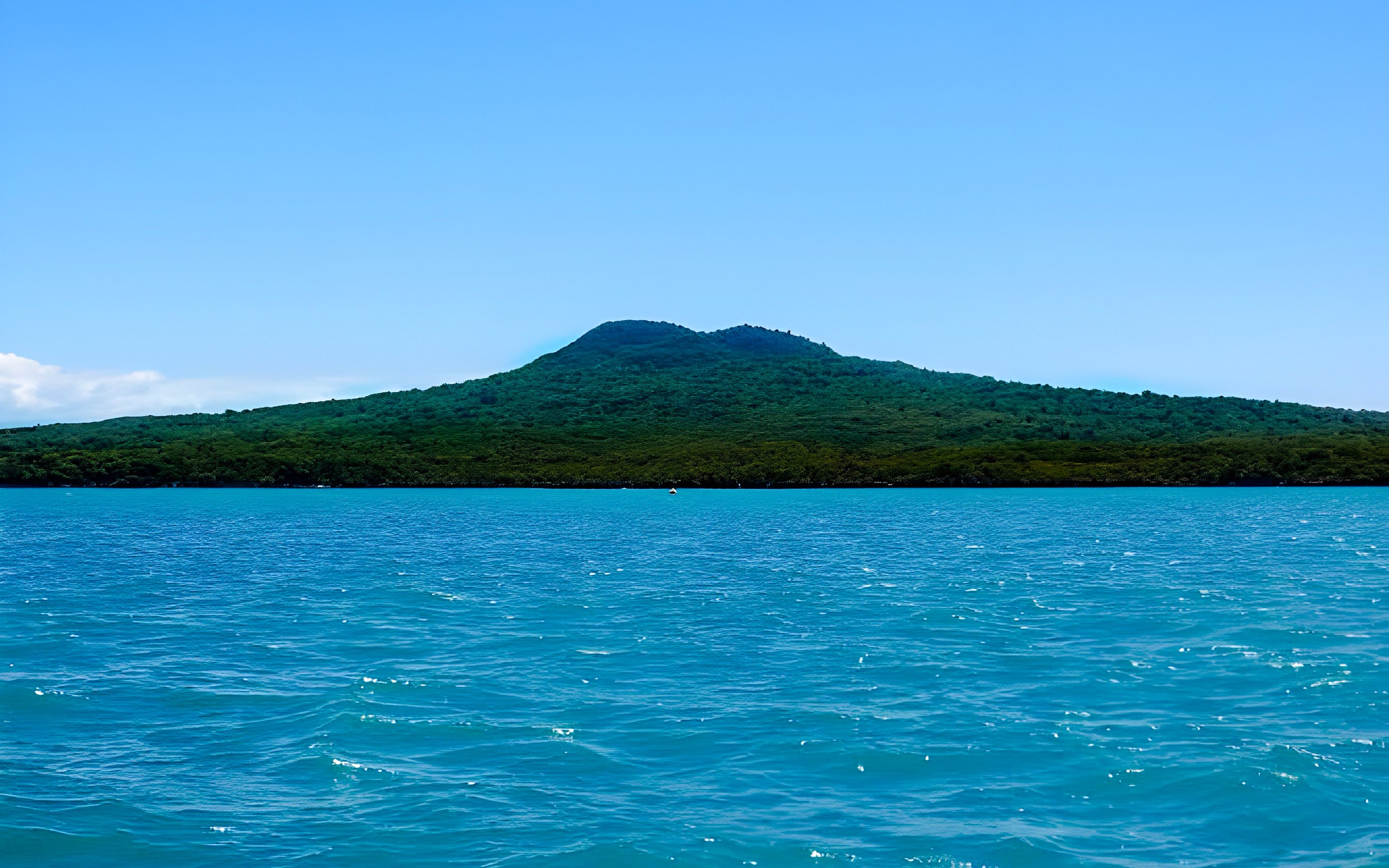 Rangitoto Island viewed from Auckland Harbour during a scenic cruise.