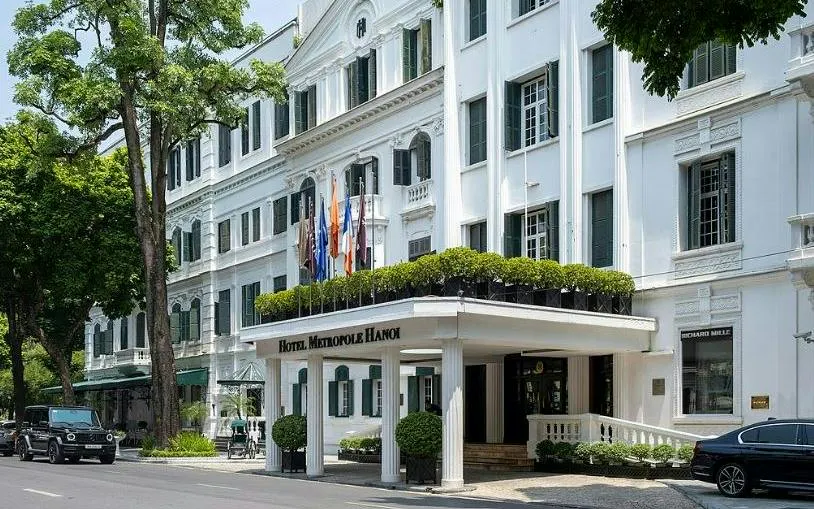Hotel Metropole Hanoi exterior in the Old Quarter, part of the self-guided city exploration game.