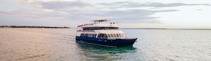 Cruise boat on Darwin Harbour during lunch tour.