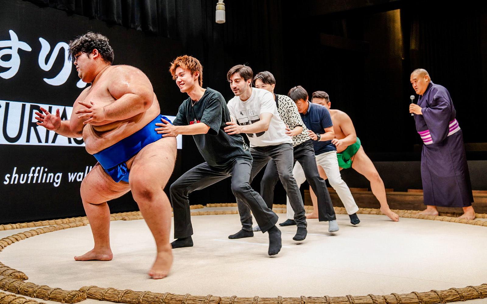 Sumo wrestlers and participants at The Sumo Hall Hirakuza Osaka.