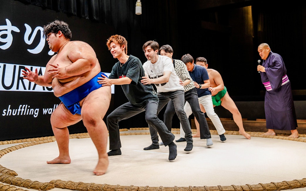 Sumo wrestlers and participants at The Sumo Hall Hirakuza Osaka.