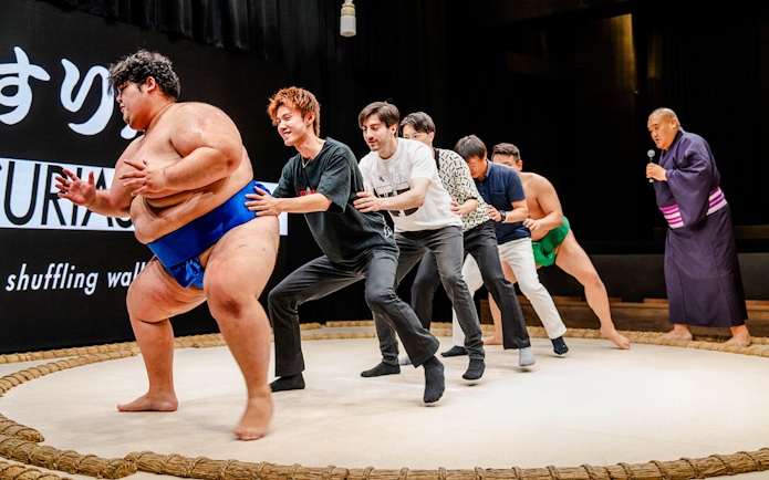 Sumo wrestlers and participants at The Sumo Hall Hirakuza Osaka.