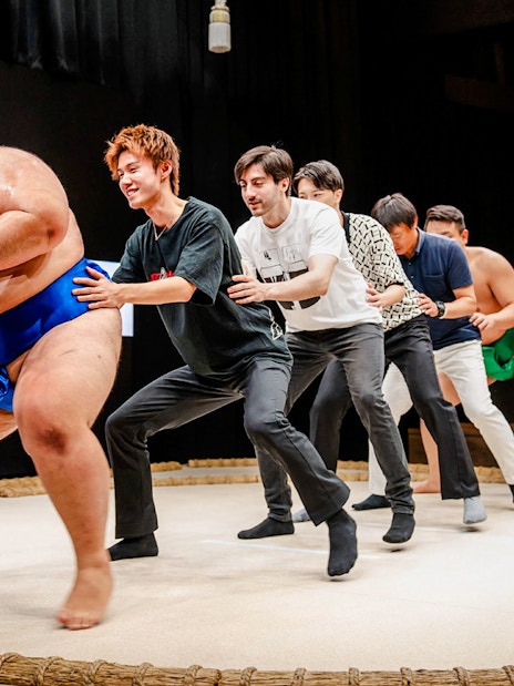 Sumo wrestlers and participants at The Sumo Hall Hirakuza Osaka.