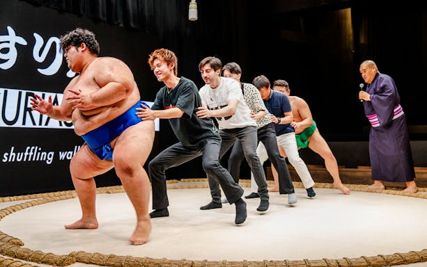 Sumo wrestlers and participants at The Sumo Hall Hirakuza Osaka.