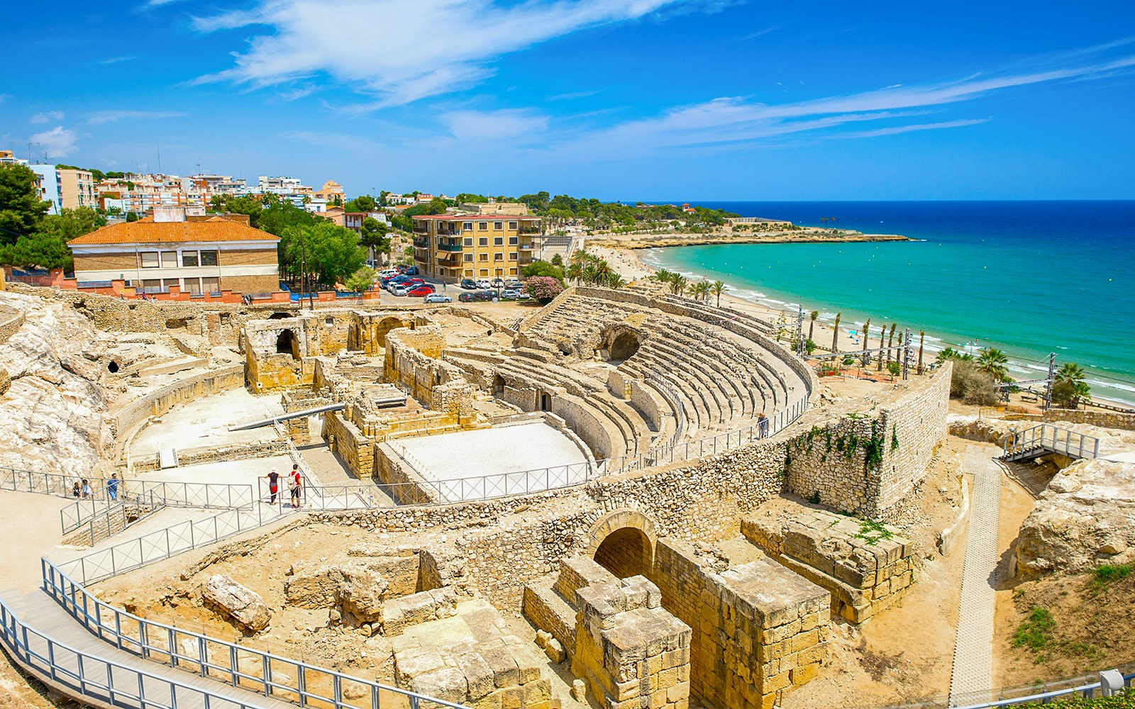 Ancient Roman amphitheater ruins overlooking the Mediterranean Sea in Tarragona, Spain.