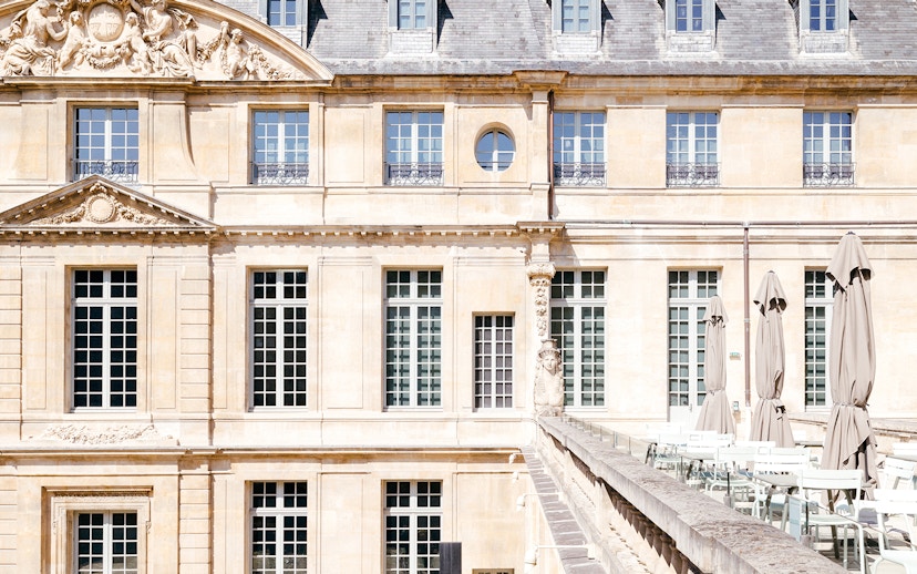 Picasso Museum terrace cafe with closed umbrellas, Paris, France.