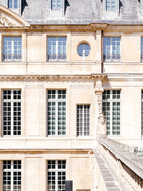 Picasso Museum terrace cafe with closed umbrellas, Paris, France.