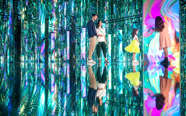 Visitors exploring the vibrant Tides installation at AYA Universe, Dubai.