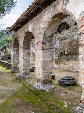 Ancient stone arches at Baiae Archaeology Park, Italy.
