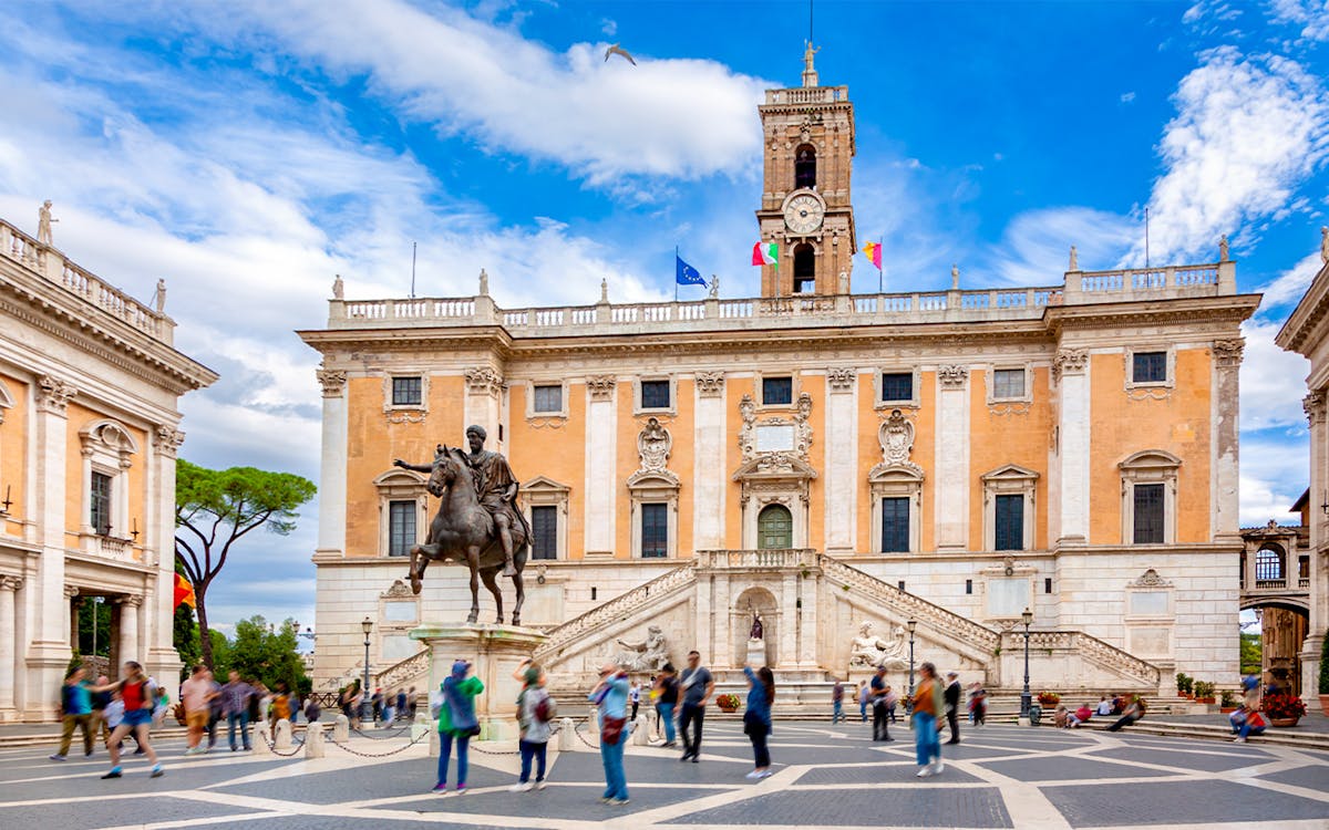 Capitoline Museums exterior with ancient Roman statues in Rome, Italy.