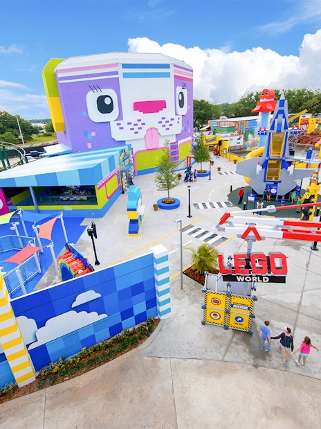 Lego Movie World entrance at LEGOLAND Theme Park, Florida with colorful attractions.