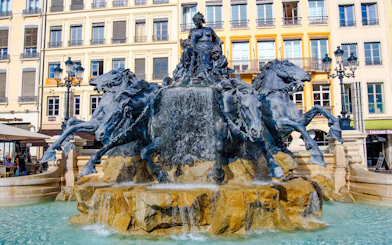 Bartholdi Fountain with horses and figures at Place des Terreaux, Lyon, France.