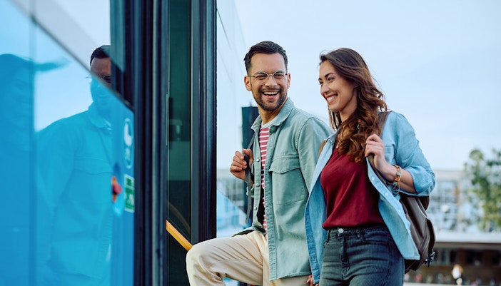 Couple boarding the bus