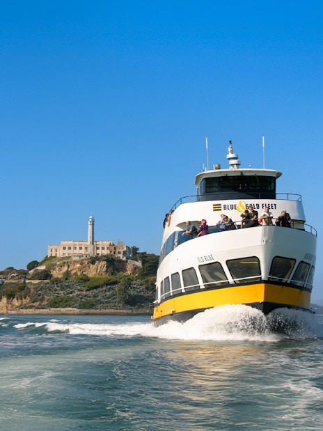 Ferry with guests sailing near Alcatraz Island, San Francisco.
