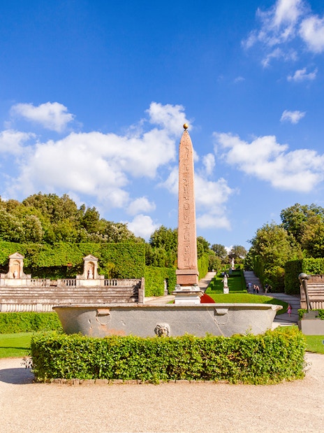 Amphitheater at Boboli Gardens with central obelisk and surrounding greenery in Florence, Italy.