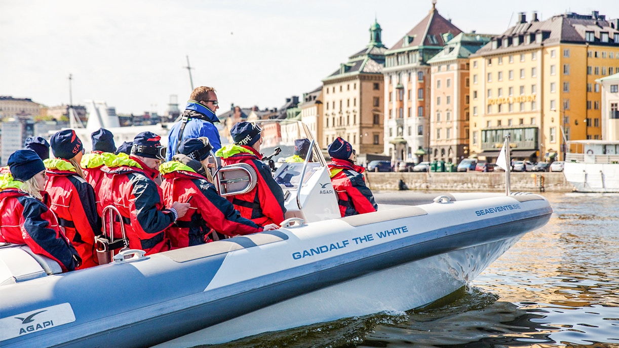 Passengers on a RIB speed boat touring Stockholm's waterfront.