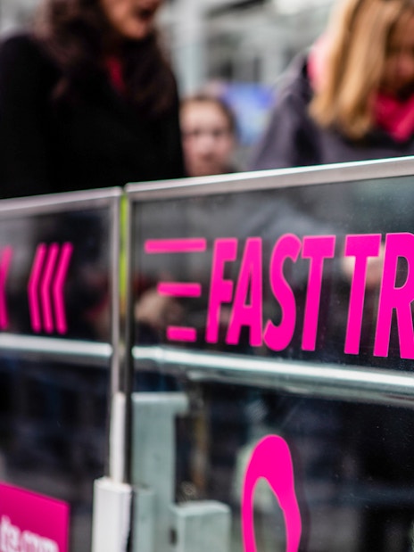 Fast track entrance for London Eye tickets with people in line.
