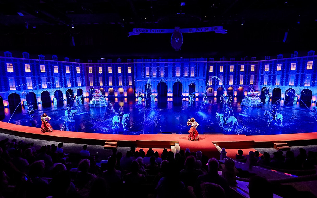 Grand Théâtre show with performers and horses at Puy du Fou, France.