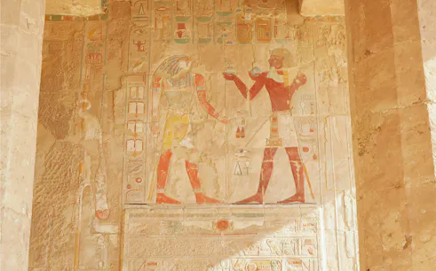 Painted sandstone relief depicting figures inside the Chapel of Anubis, Mortuary Temple of Hatshepsut, Luxor.