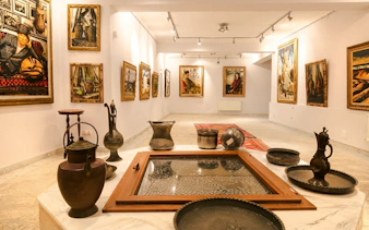 Artworks and traditional vessels displayed in the House-Museum of Tahir Salahov, Baku.