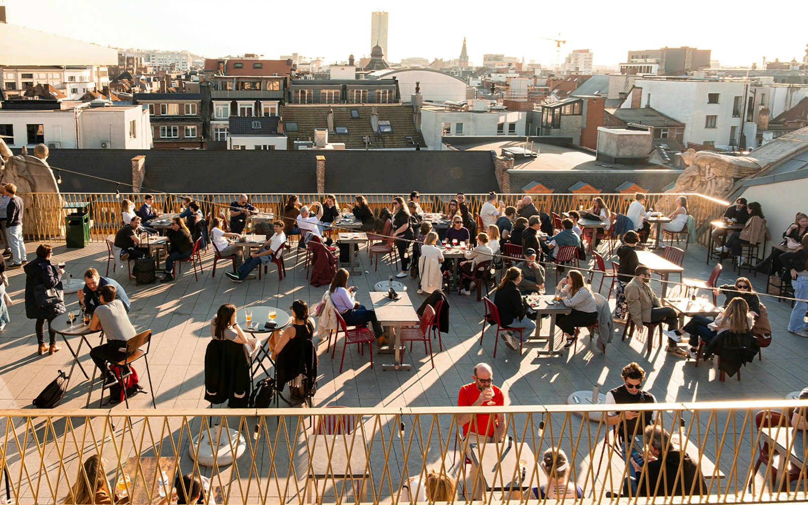 Rooftop terrace with people enjoying drinks at Belgian Beer World Experience in Brussels.