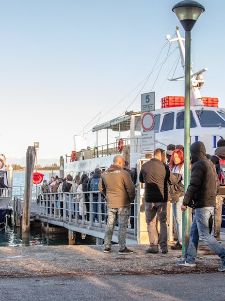 Passengers boarding a ferry at the Venice port.