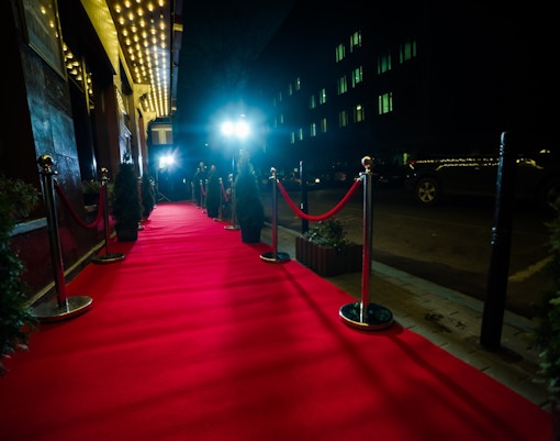 Olivier Awards 2023 red carpet with attendees at award ceremony.