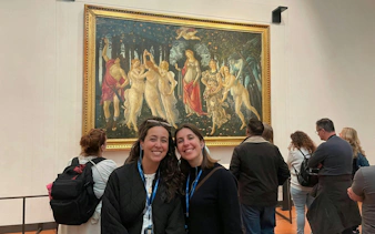 Visitors viewing Botticelli's "Primavera" at the Uffizi Gallery.